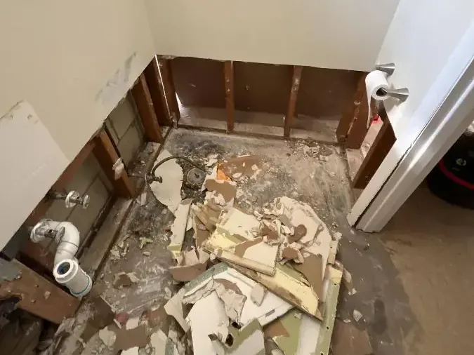 Bathroom taken down to the studs after a sewage backup was cleaned up